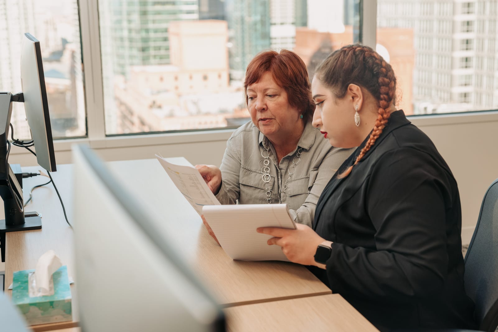 A mentor and mentee collaborating, representing inclusive and accessible education.